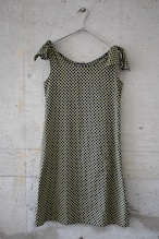 Black and yellow dress with a hollow-dot pattern