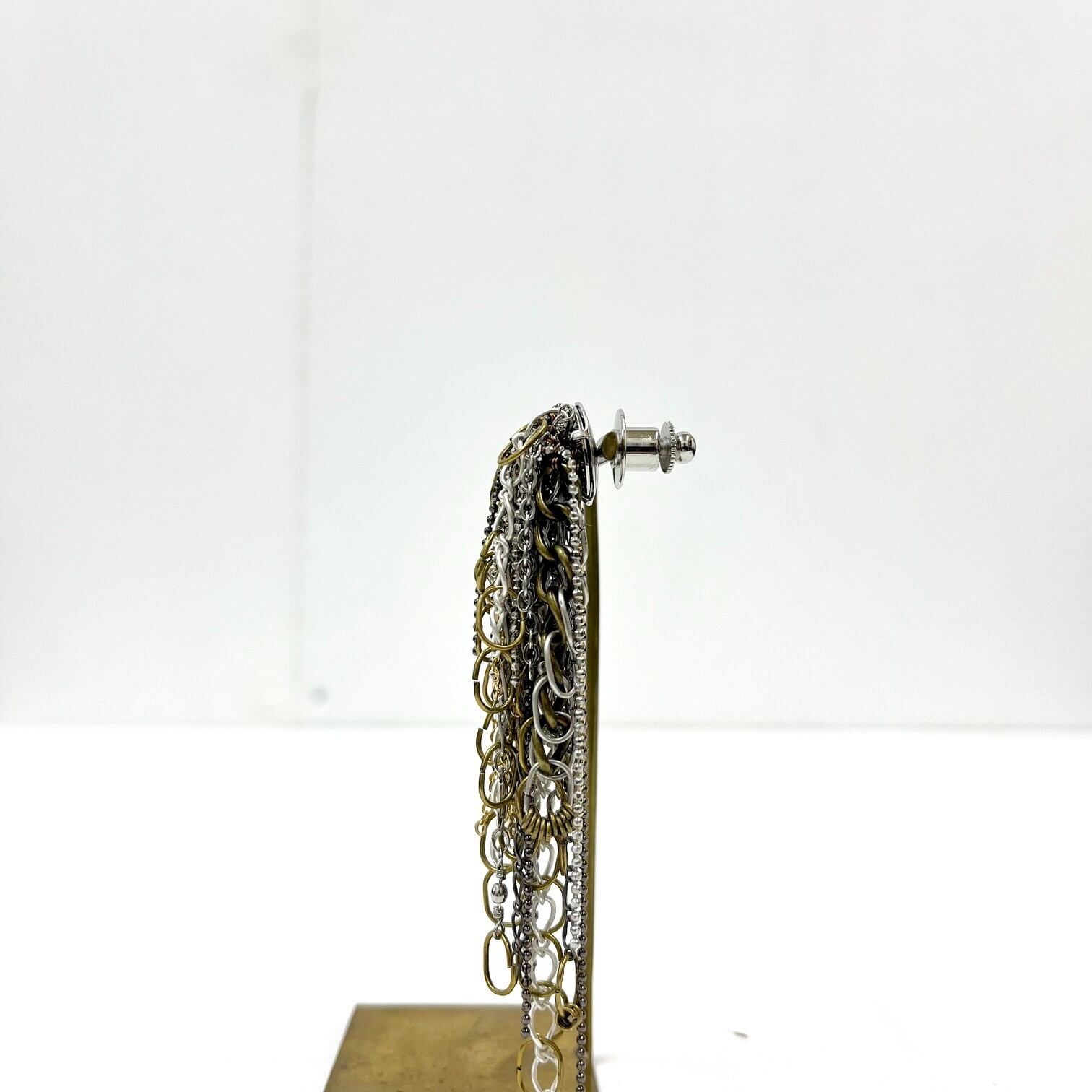 NAKED CRYSTAL / チェーンをじゃらじゃらとつけたピンブローチ（A