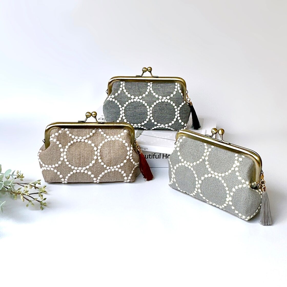 ミナペルホネン タンバリン生地のタッセル付きがま口ポーチ | Pay ID 