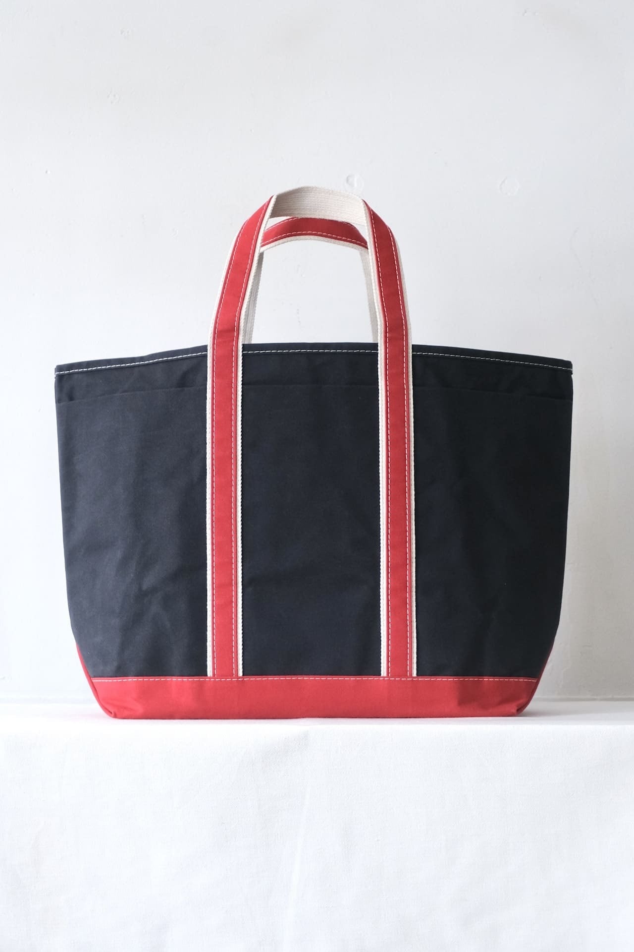 "Order Event" This is a(n) Base Field Tote XL Navy/Red,Navy/Forest Green