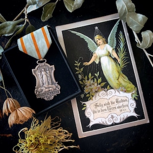 巡礼のメダルと天使のデスカード