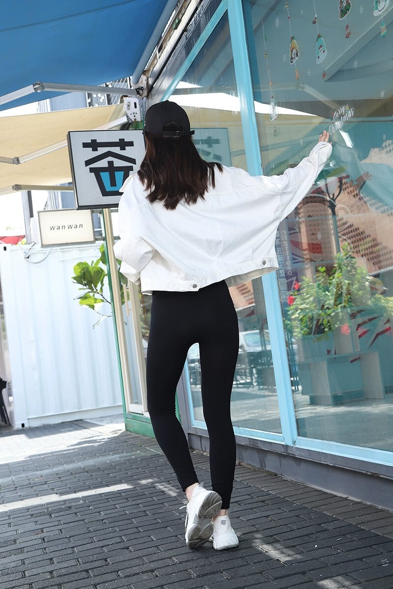 破れたパンツの女性のファッションハイウエスト黒レギンス春と秋の