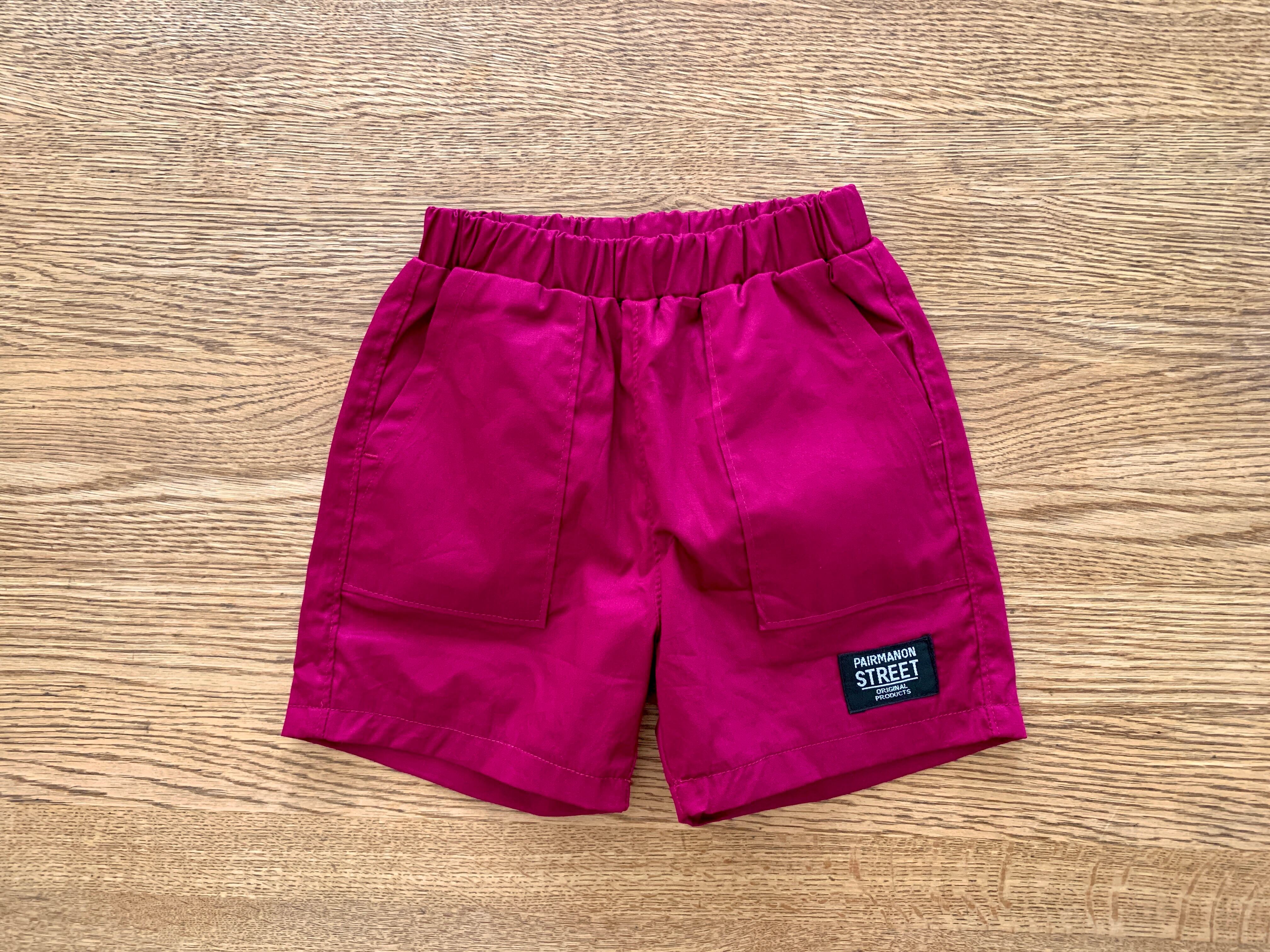 ビビットピンクのユニセックスハーフパンツ90cm