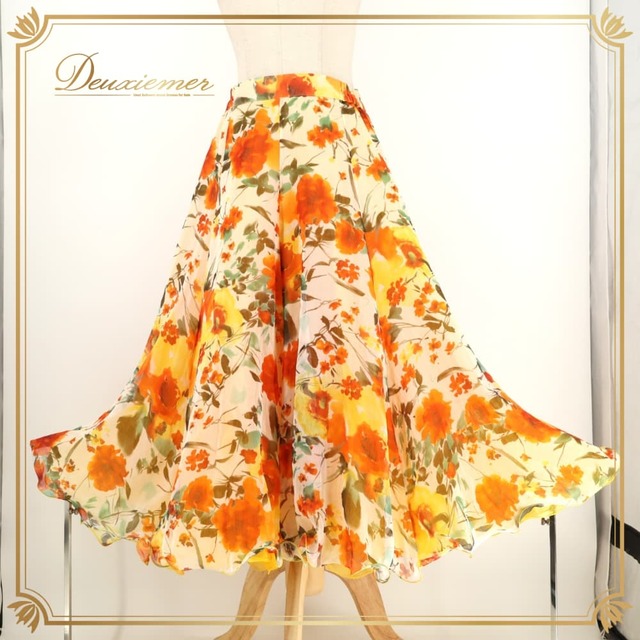 社交ダンス 衣装 Leirena レイリーナ スカート レッスンウェア オレンジ系 花柄 植物柄 フラワープリント オーガンジー生地 透け感 シースルー ふんわり ボリューミー 華やか 鮮やか かわいい おしゃれ 上品 橙 黄 緑 白 イエロー系 ホワイト系 グリーン系 ダンス 練習 レッスン ダンス衣装 練習着