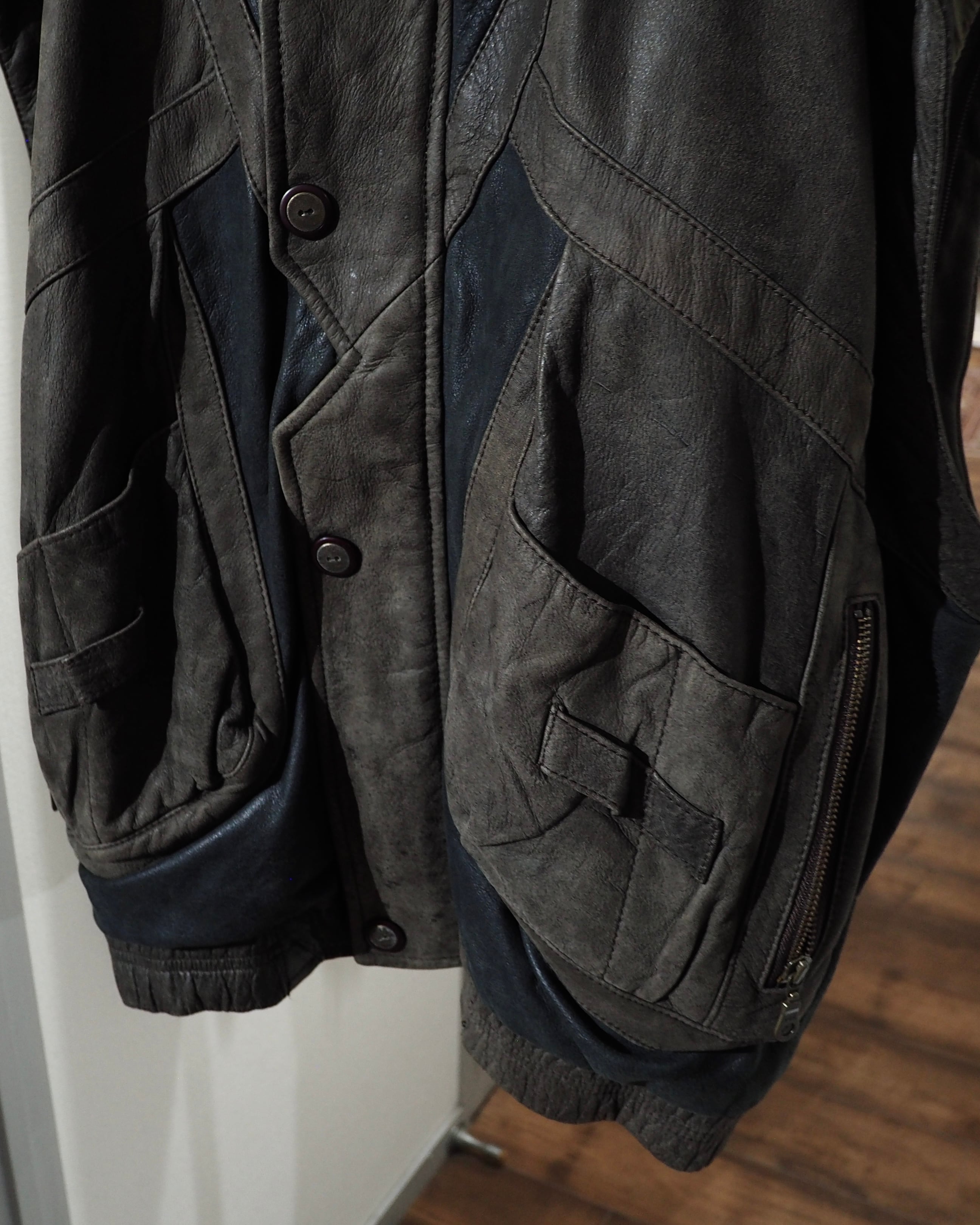 " 変形 × 分離 " Sleeve Detachable Gimmick × Panel Switching Vintage Loose Leather Jacket
