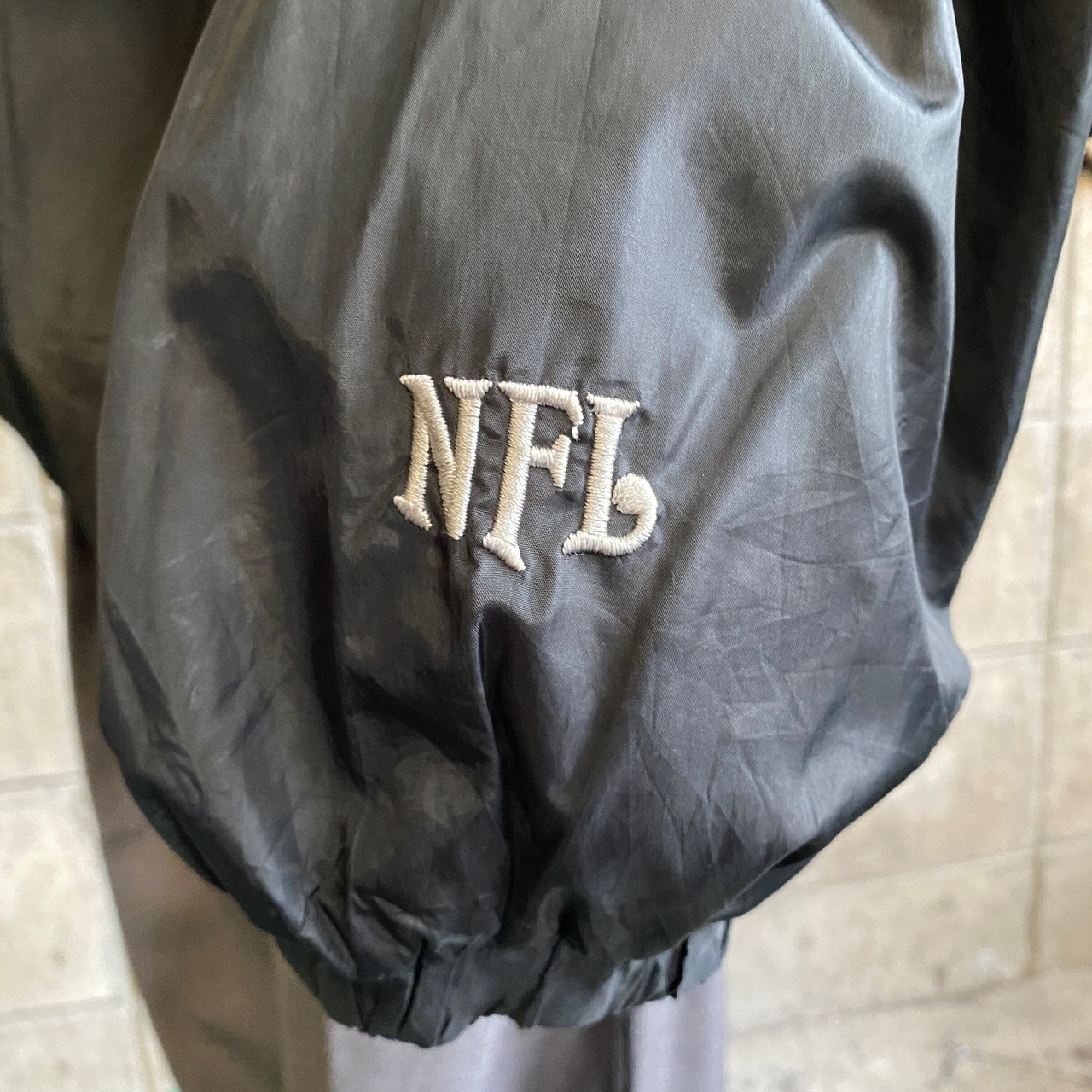 NFL ラスベガス・レイダース ナイロンプルオーバー メンズXL 古着 