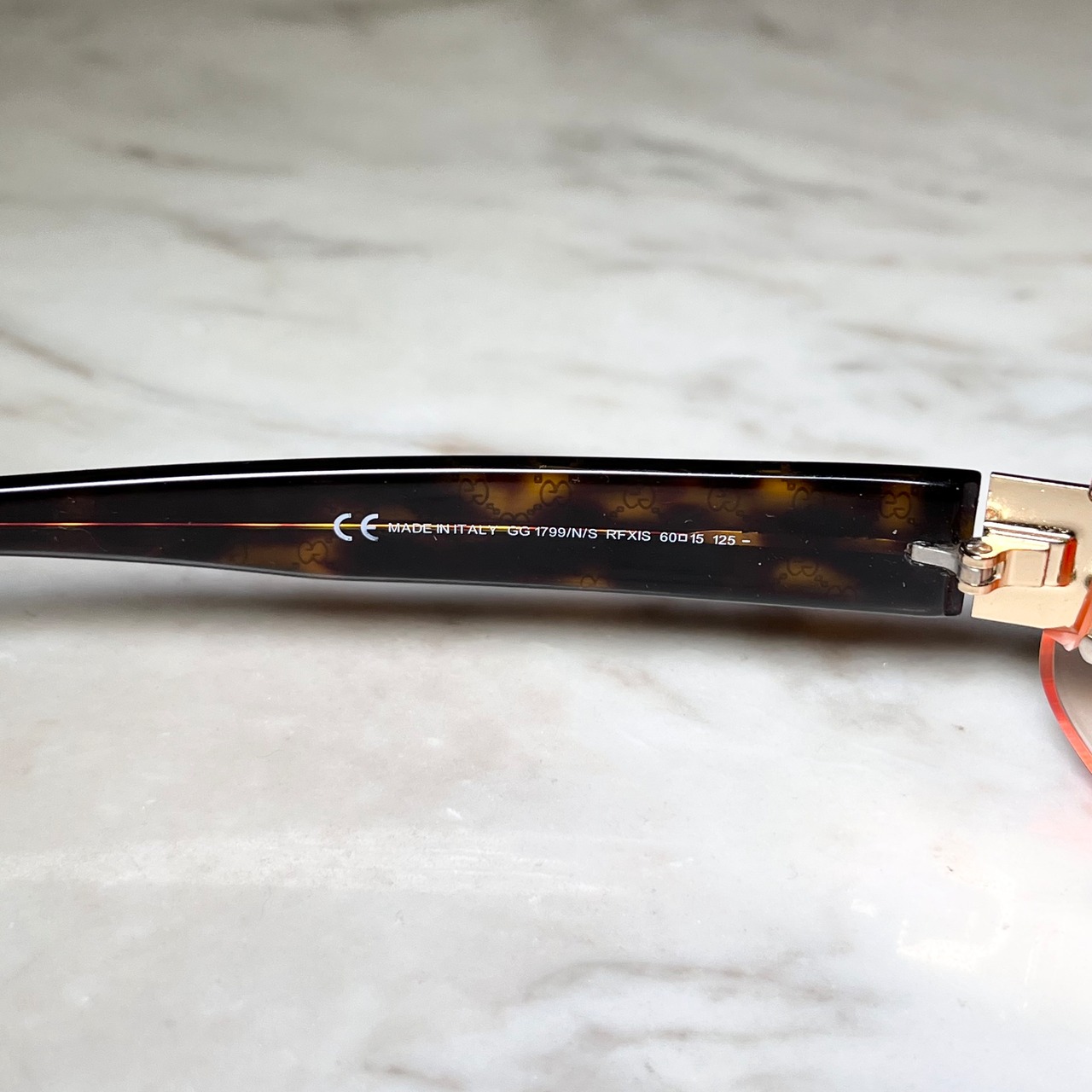 GUCCI half-rim glasses with orange color lens