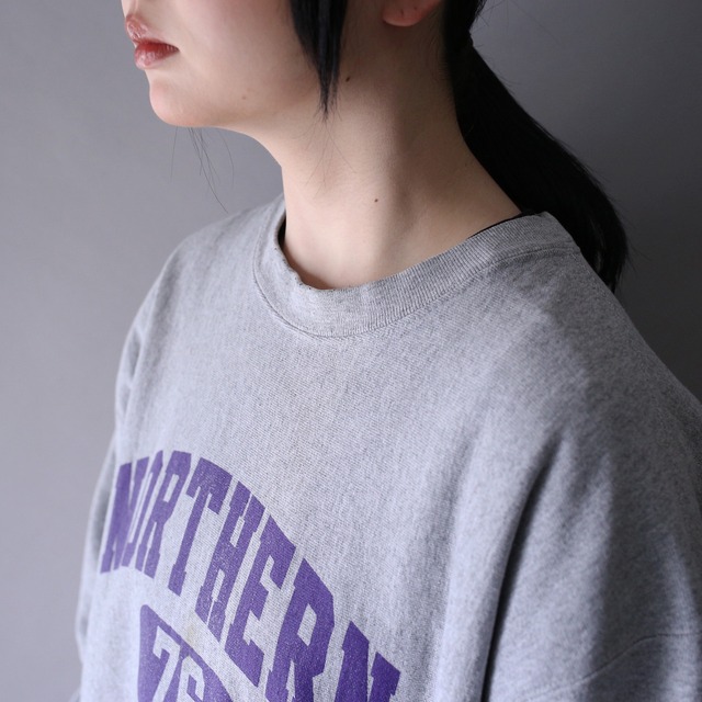 "Champion" college logo over silhouette reverse weave