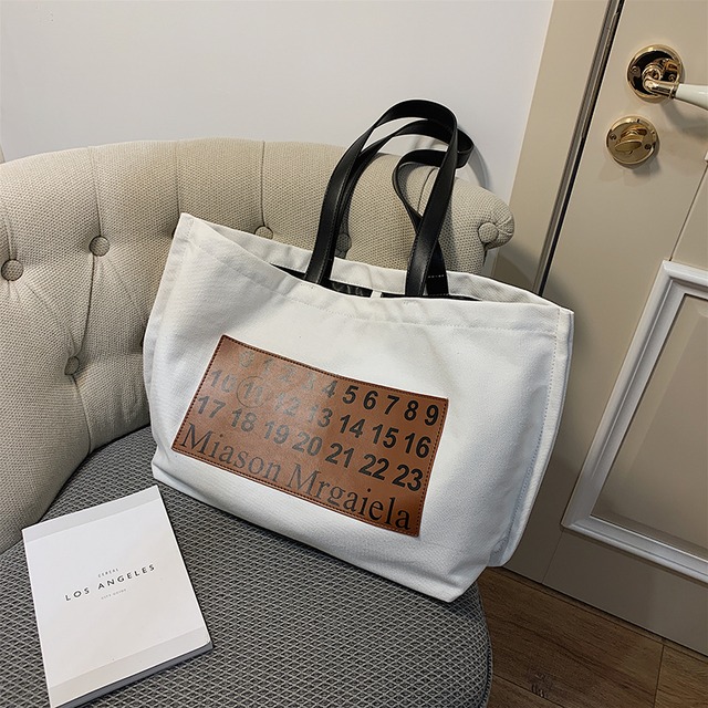 大容量ショルダーバッグ女性バッグ2020人気の新しい新しい流行のファッションすべてのマッチした携帯用キャンバスバッグネット赤いトートバッグ Tiancai_Wing_Bag9593367