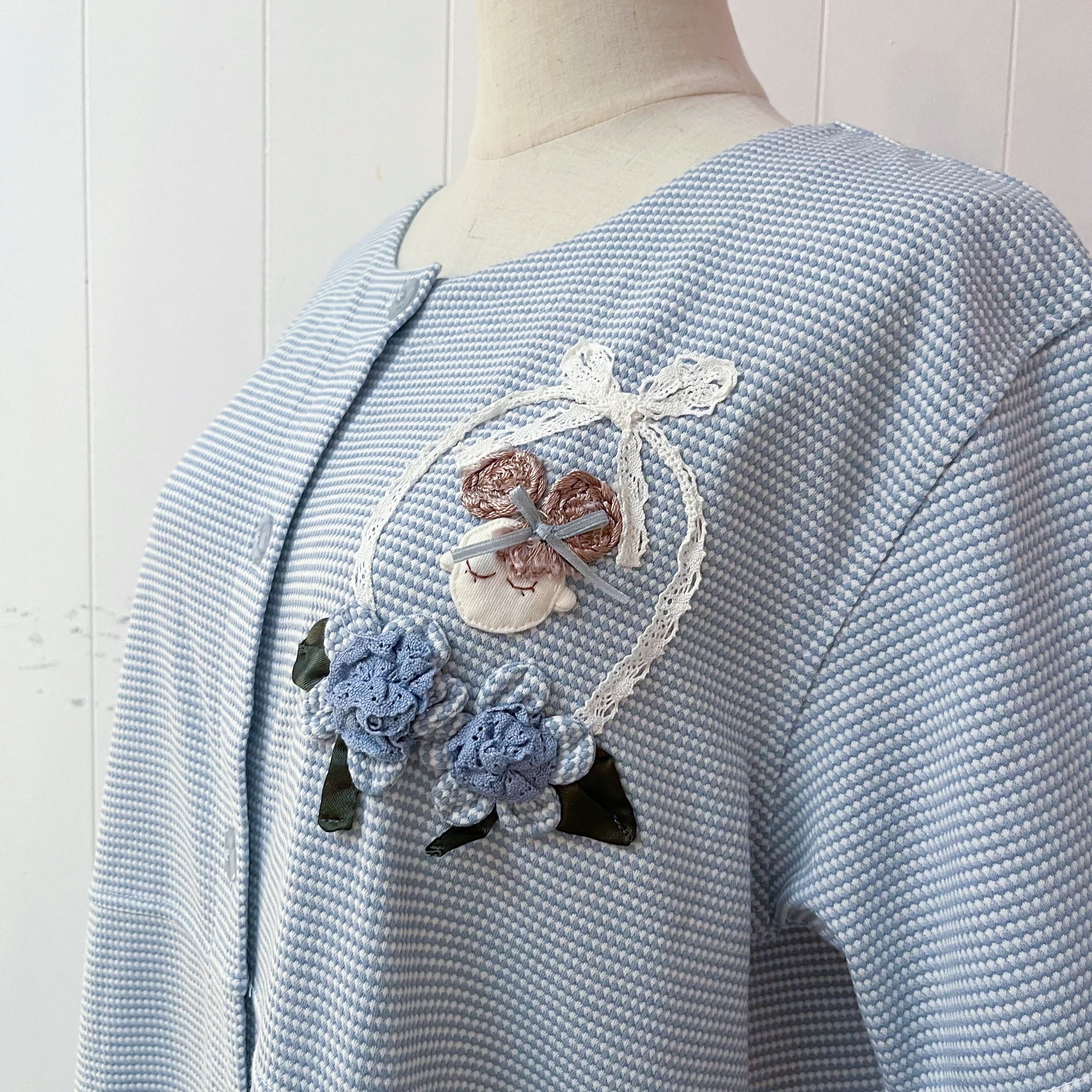 doll applique light blue one-piece