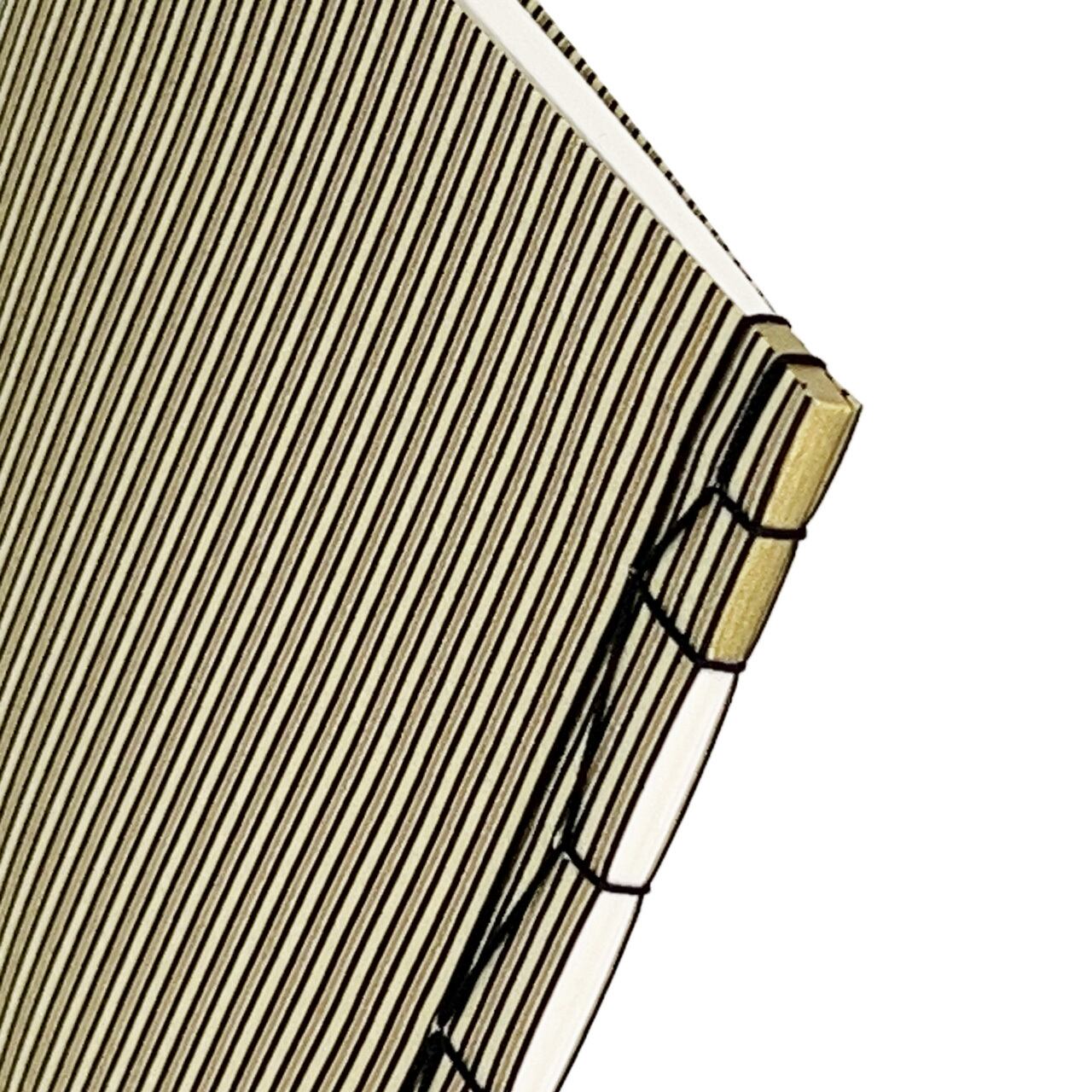 縞模様 —Black and gold stripes on beige background in Japanese