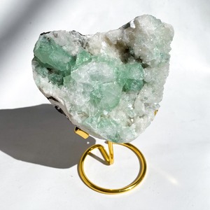 Green apophylite with gold stand