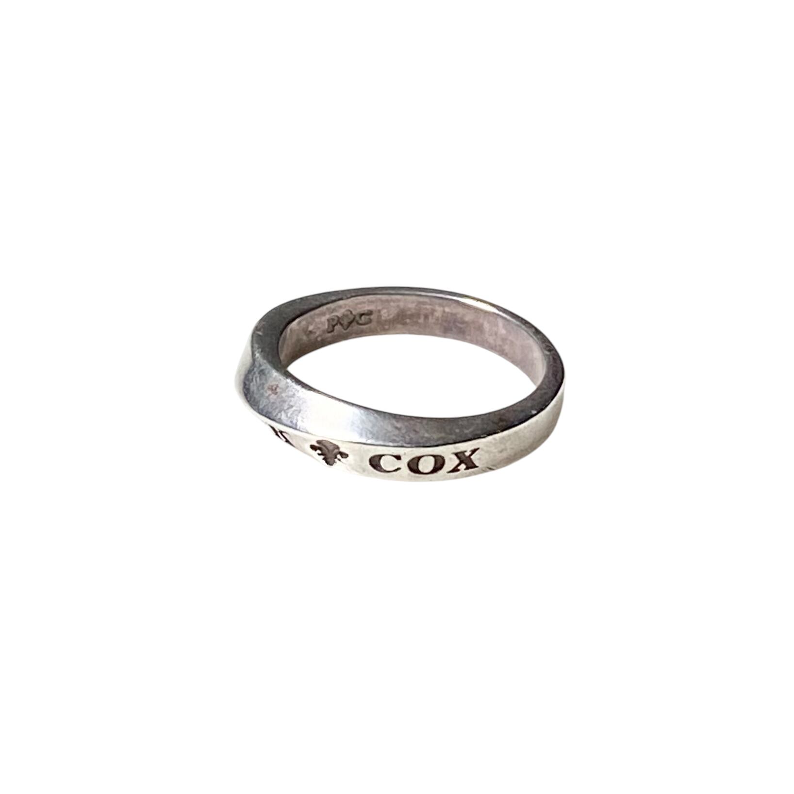 PATRICK COX silver spiral logo ring | NOIR ONLINE