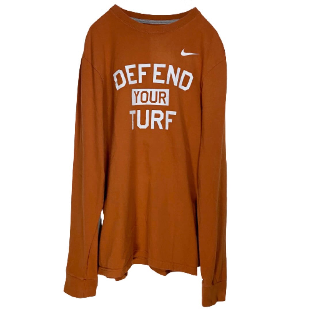 ナイキ DEFEND YOUR TURF ロンT オレンジ S 古着 NIKE