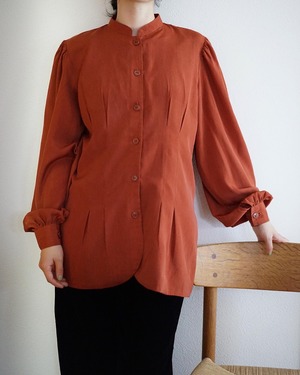 dark orange shirt