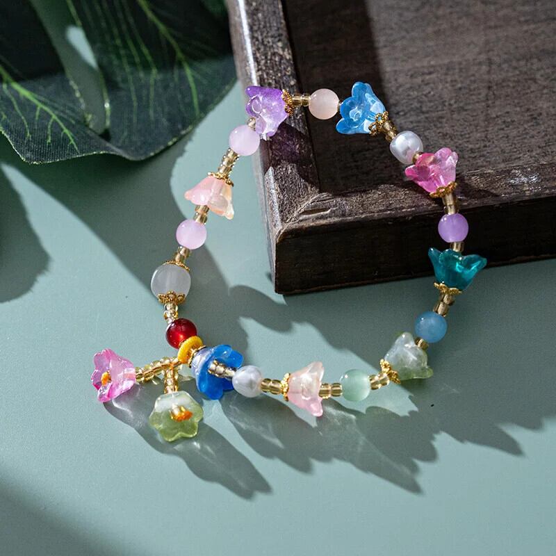 カラフルな花モチーフブレスレット カラフル花モチーフビーズブレスレット - メルカリ