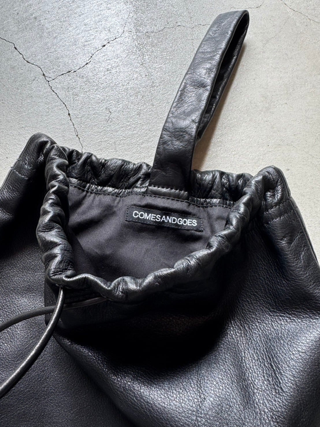 COMESANDGOES COMES DRAWSTRING BAG | brownriver