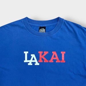 【LAKAI】USA製 ロゴ Tシャツ バックプリント 99 ナンバリング スケボー ラカイ ブルー M US古着