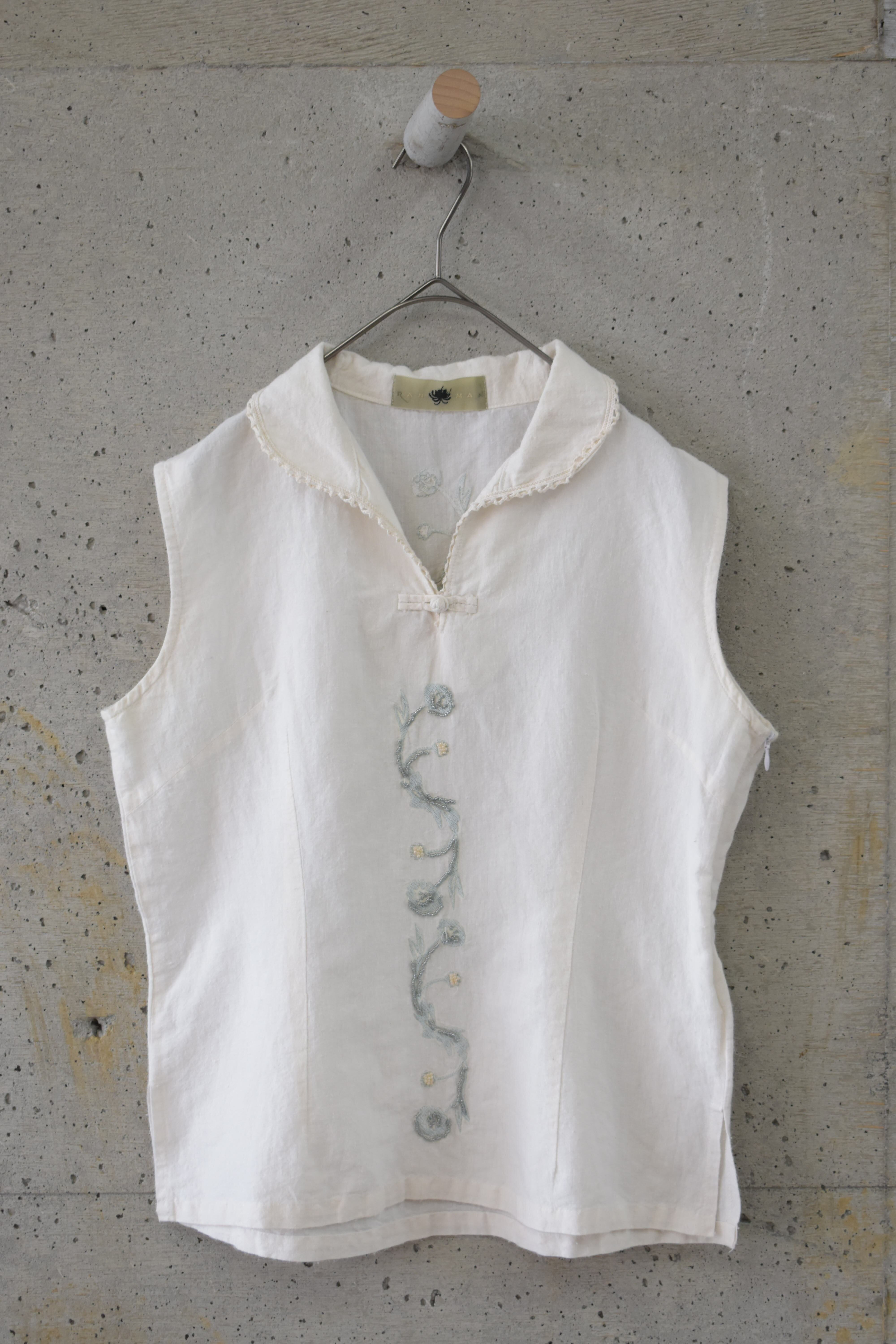 Sleeveless top with floral bead embroidery