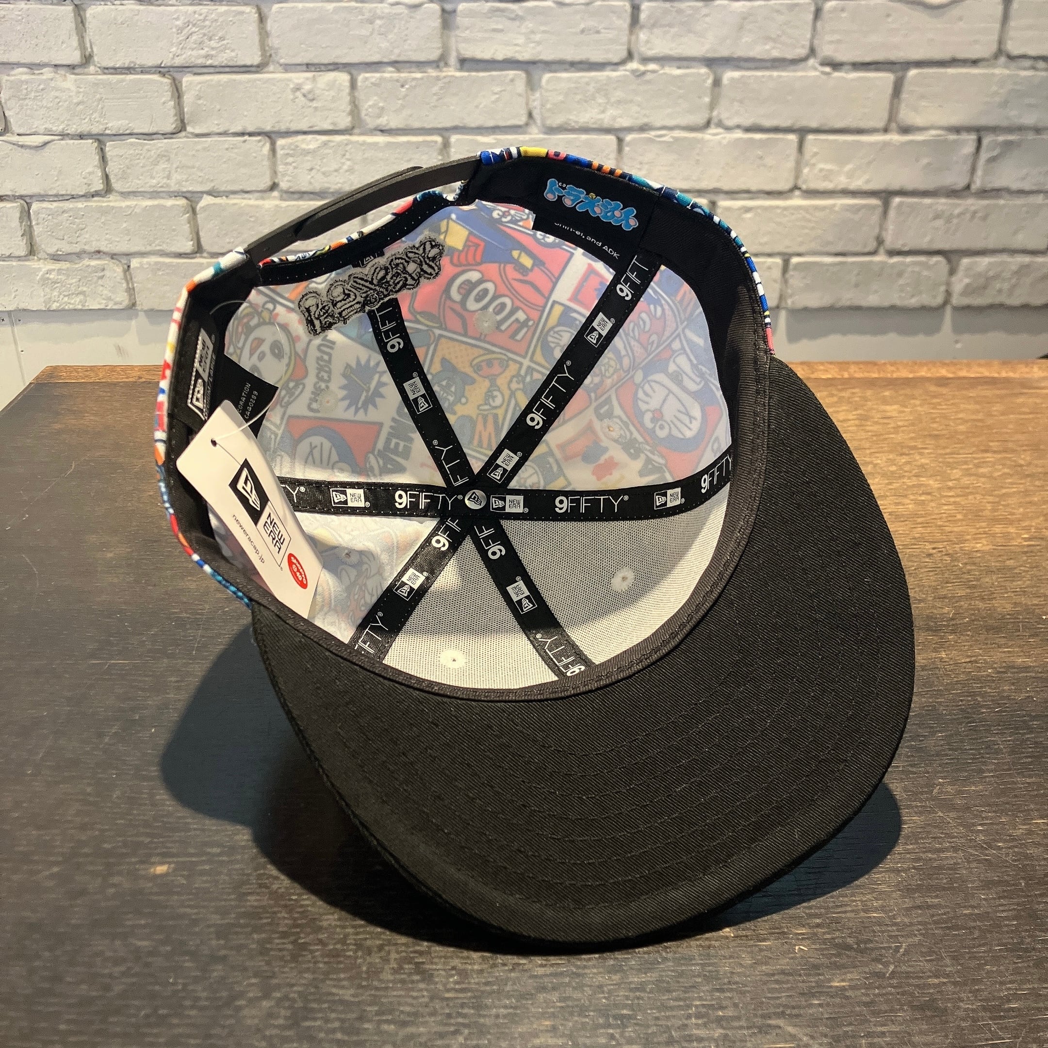 NEWERA】9FIFTY ドラえもん ALL OVER PRINT BLACK VISOR キャップ