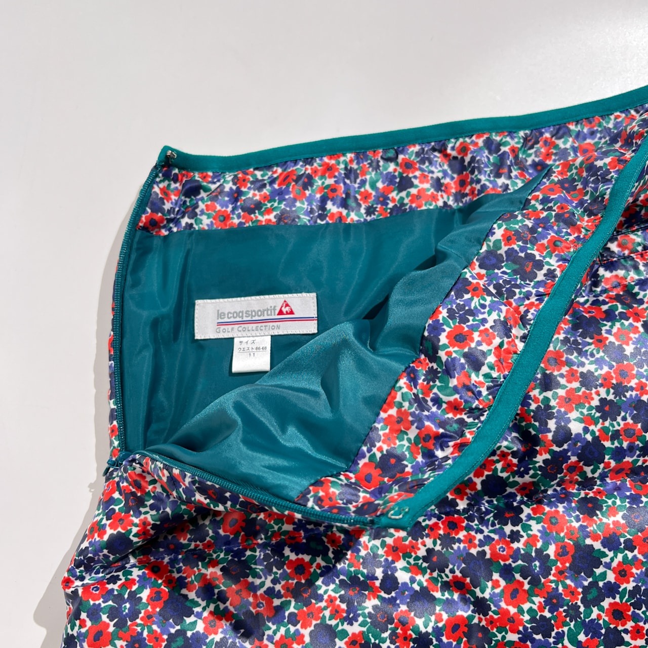 上下セット le coq sportif GOLF ルコックゴルフ 花柄 総柄 ダウンベスト&スカート セットアップ サイズ L /デサント レディース