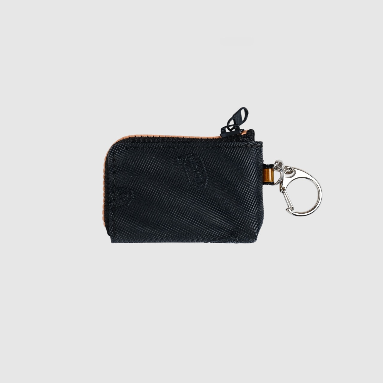 vibram coin pouch keychain (black×orange) with orange glowing zip