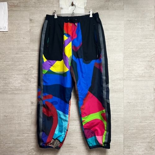sacai × KAWS サカイ×カウズ トラックパンツ イージーパンツ 総柄 