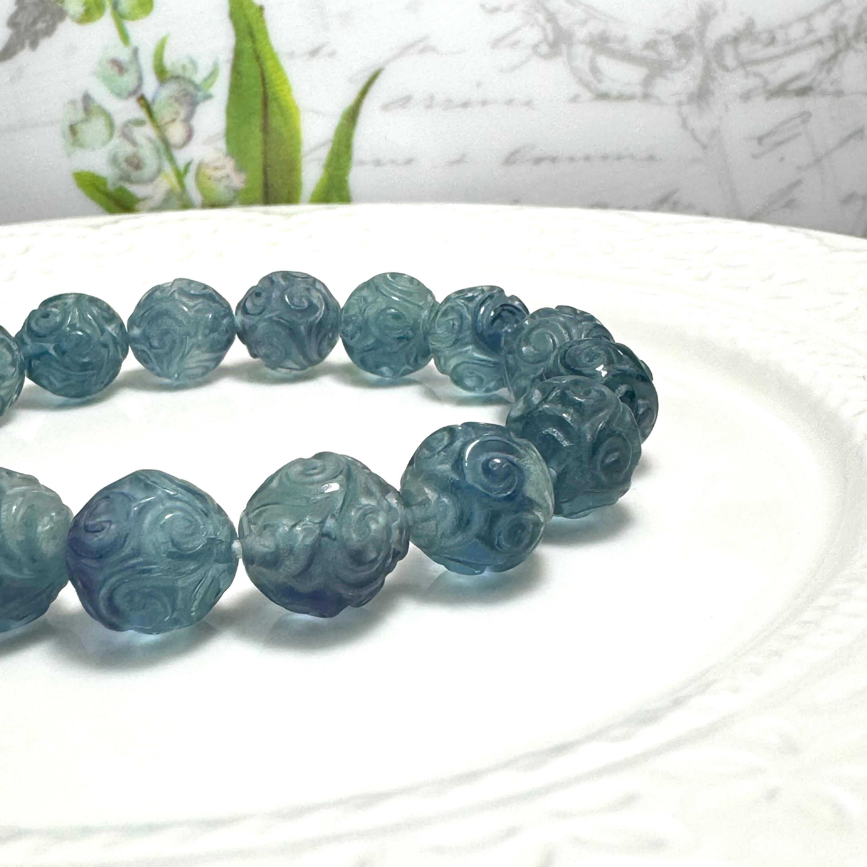 ブルーグリーンのマニ車彫りフローライトのブレスレット