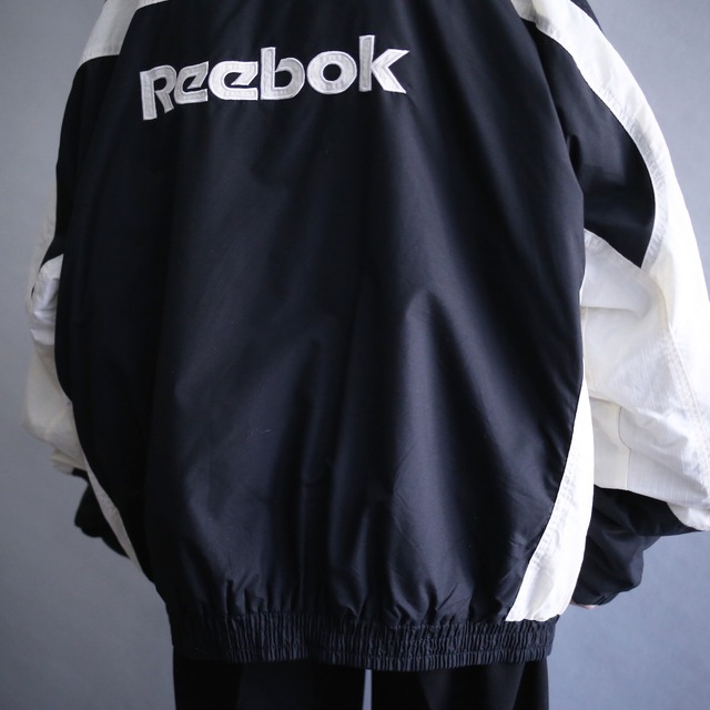 "Reebok"  3-tone switching color back logo design loose silhouette nylon blouson