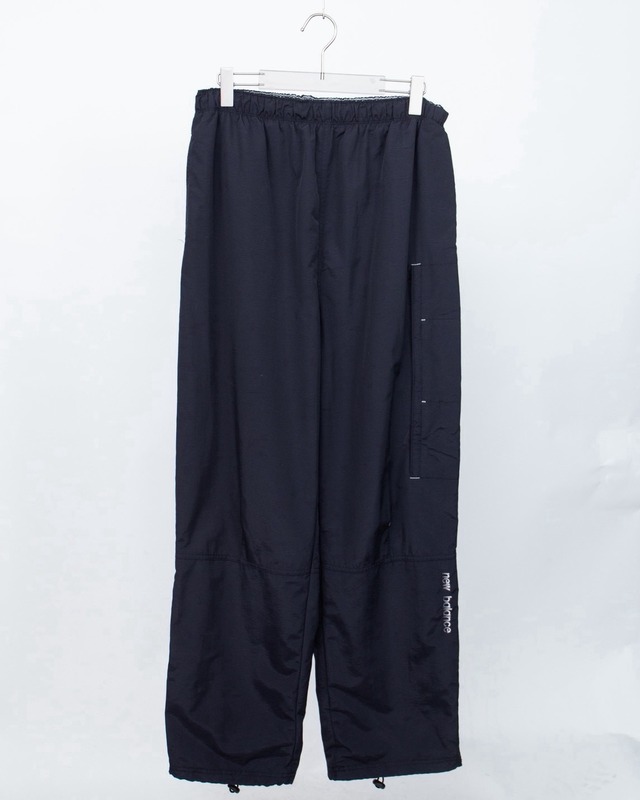 "NEW BALANCE" baggy silhouette nylon trousers