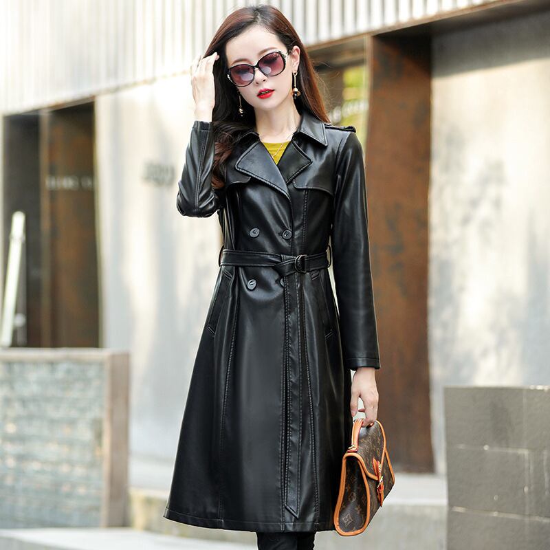 秋の革のコートの女性ロンググリーンサッシダブルブレスト拡張革風