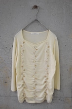 Knit top with seashell bead embellishment