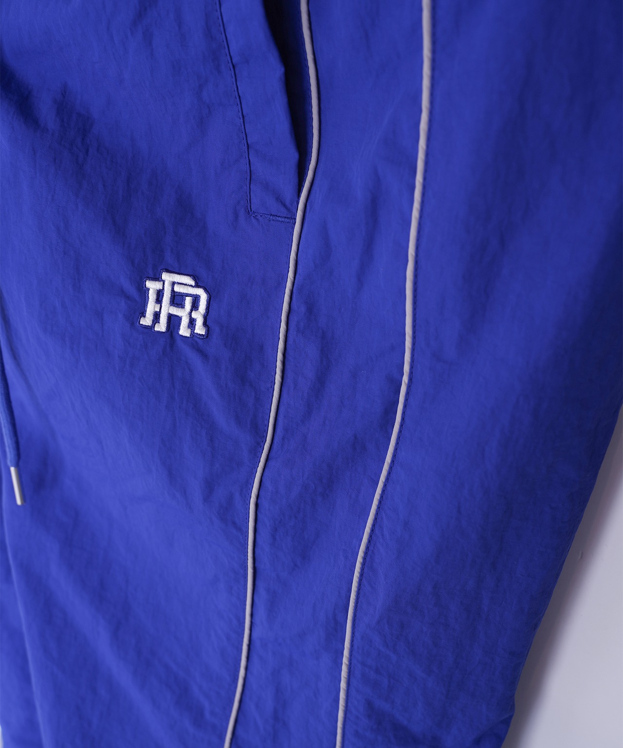【#Re:room】NYLON PIPING TRACK PANTS［REP277］