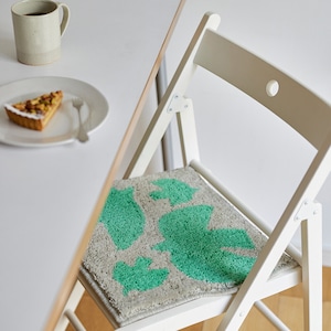 Chair pad with birds flapping their wings