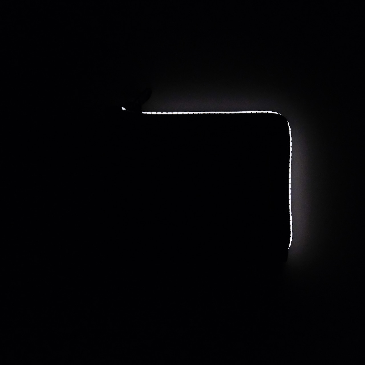 vibram Lzip wallet (black×orange) with orange glowing zip