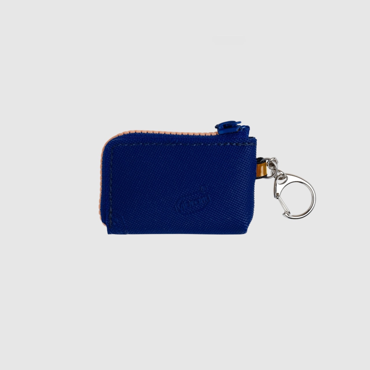 vibram coin pouch keychain (navy×orange) with orange glowing zip
