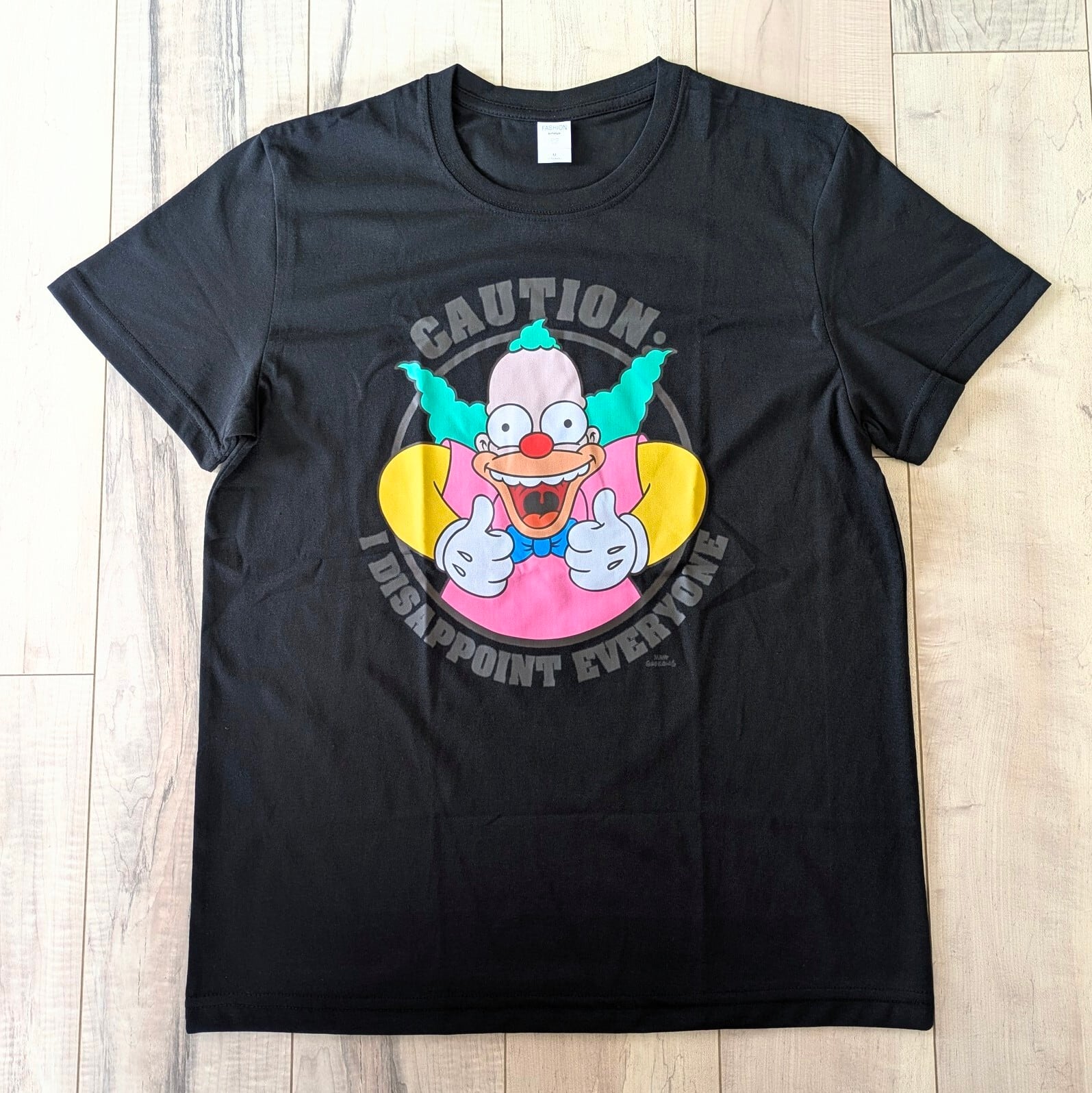【 The Simpsons（ ザ・シンプソンズ ) 】『 CAUTION: I DISAPPOINT EVERYONE 』クラスティ・ザ・クラウン / Tシャツ〚アメリカン雑貨 アメトイ〛