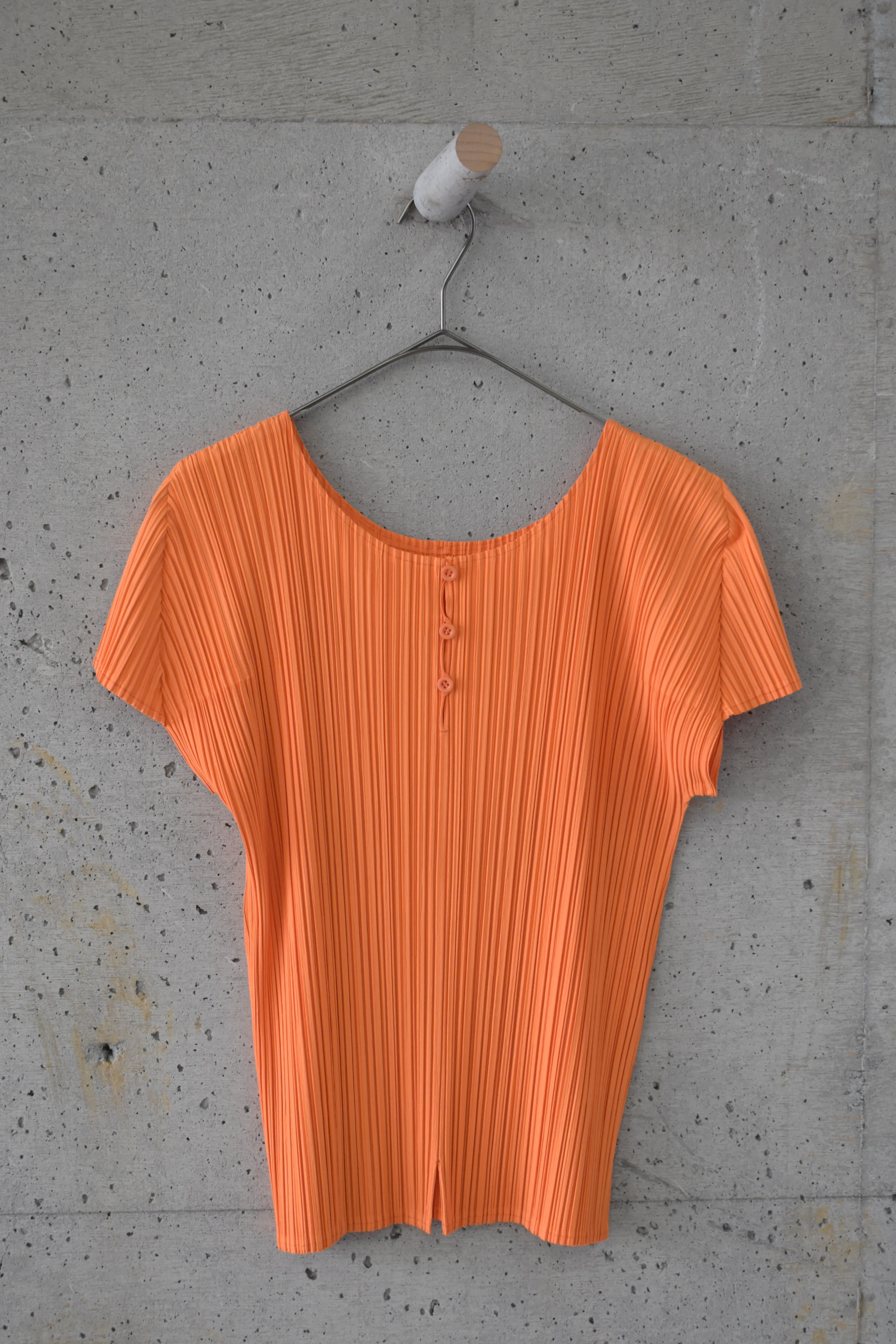 Orange pleated top