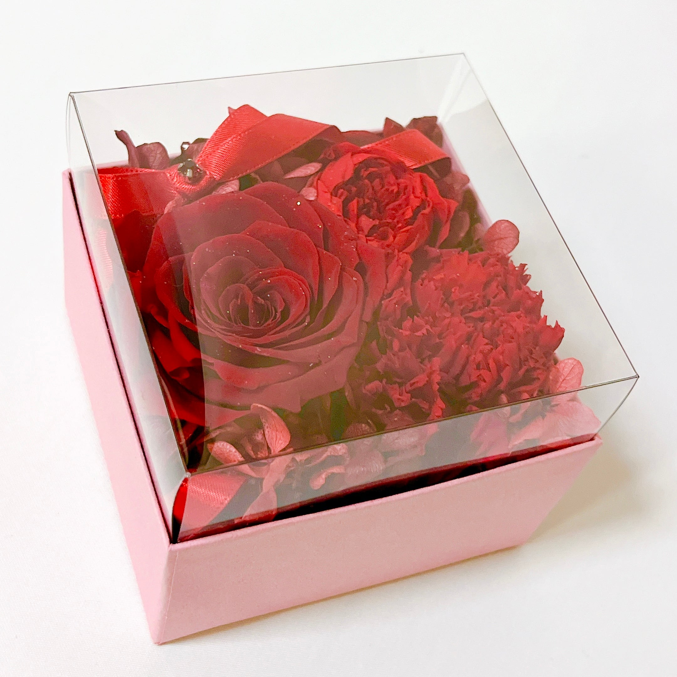 プリザーブドフラワー　豪華　華麗　ピンク　バラ　カーネーション プリザーブドフラワーの壁掛け フレームアレンジ ピンクのバラに