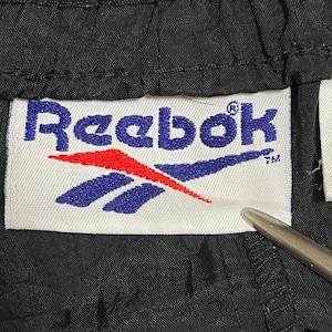 【Reebok】90s 刺繍タグ ウインドブレーカーパンツ ナイロンパンツ シャカパン 刺繍ロゴ 裾チャック M リーボック スポブラ US古着
