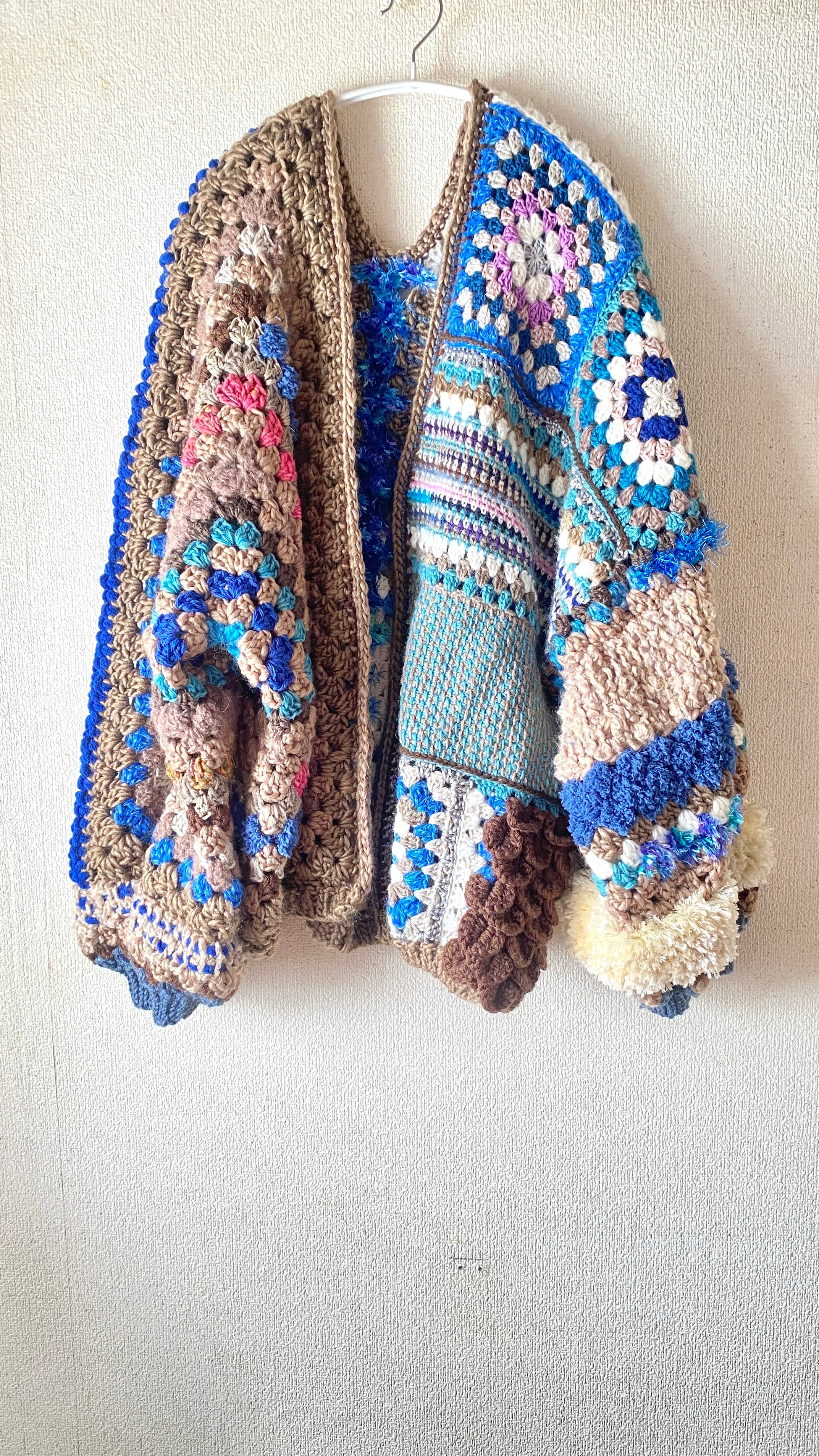 Crocheted granny hexagon and square motif asymmetrical cardigan