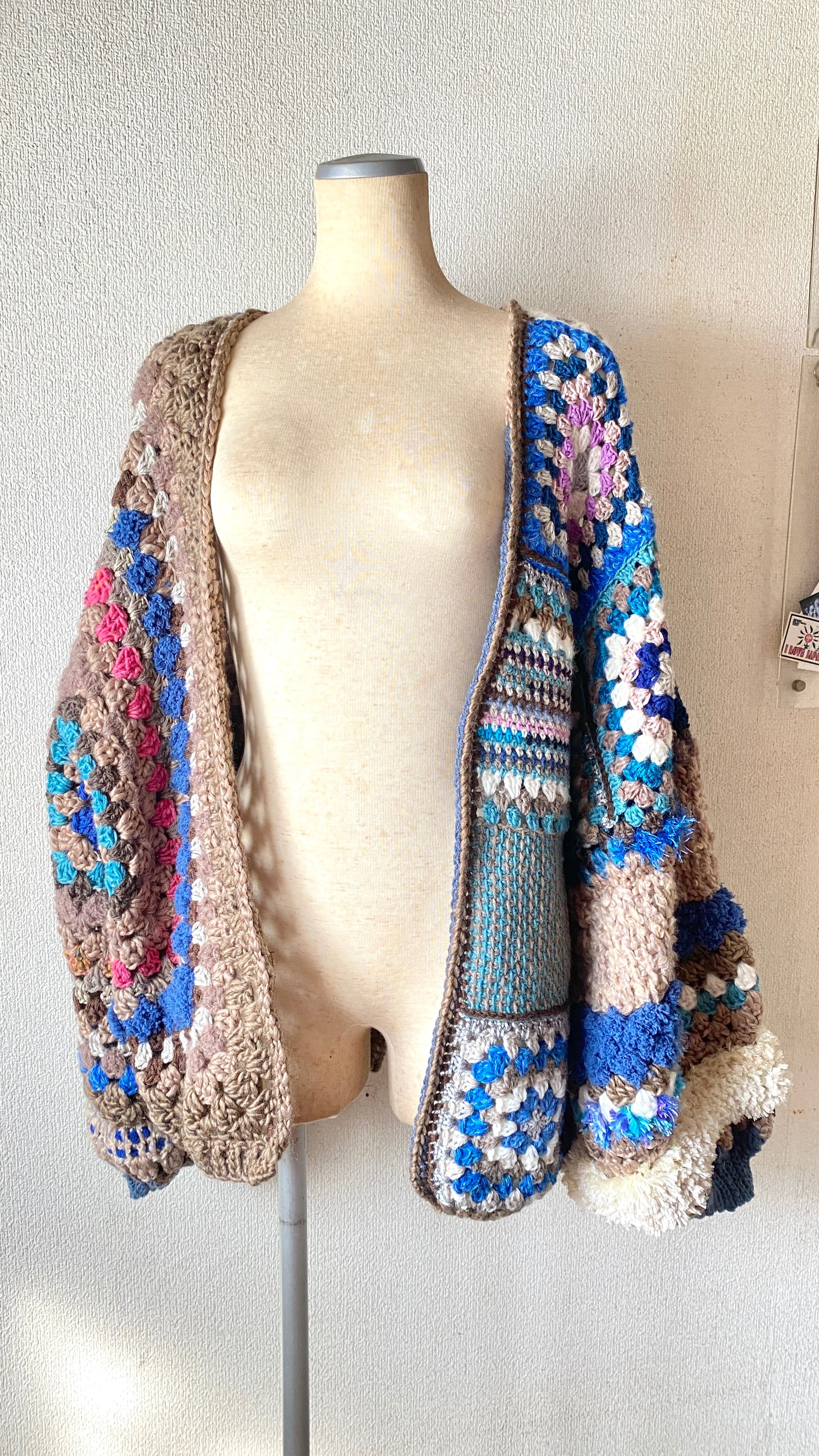 Crocheted granny hexagon and square motif asymmetrical cardigan