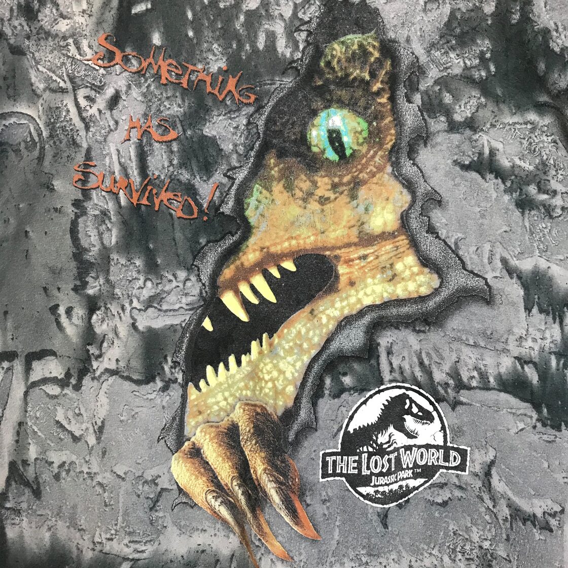 ☆THE LOST WORLD JURASSIC PARK 総柄 T-sh 覗き恐竜 Tシャツ サイズ 