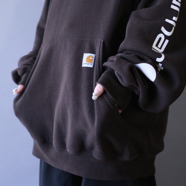 "carhartt" sleeve printed design over silhouette brown parka