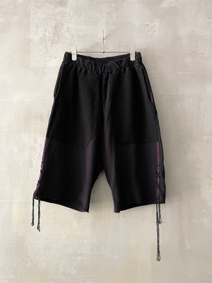 TrAnsference inside-out pile twin patch pocket dangling cord hem shorts - complete black garment dyed