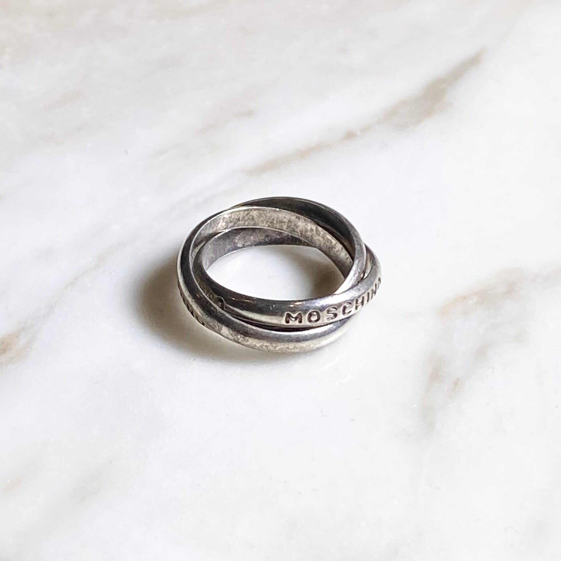 MOSCHINO silver trinity ring | NOIR ONLINE