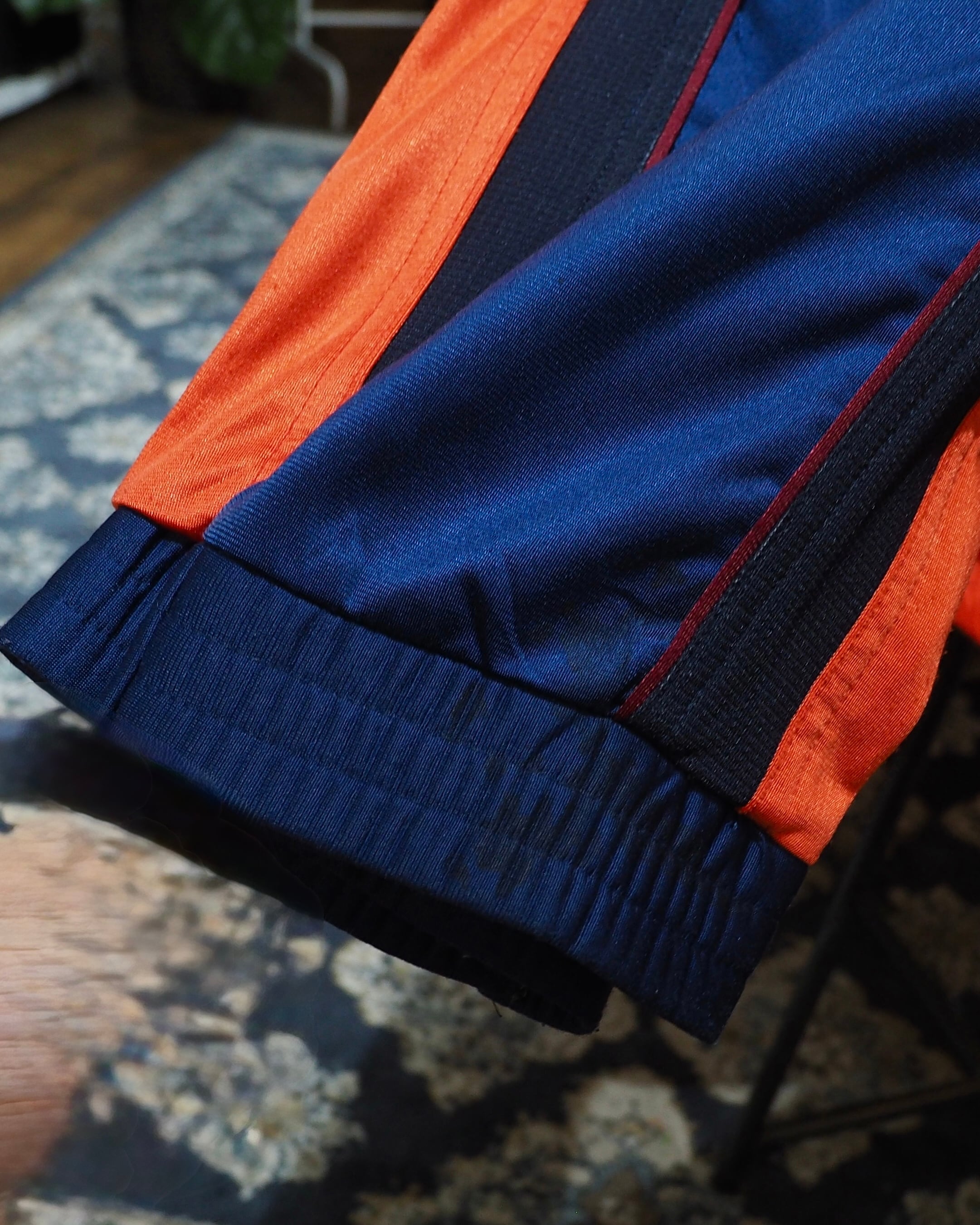 1990s " UMBRO " Vivid Orange × Dark Navy Switching Panel Vintage Loose Track Jacket