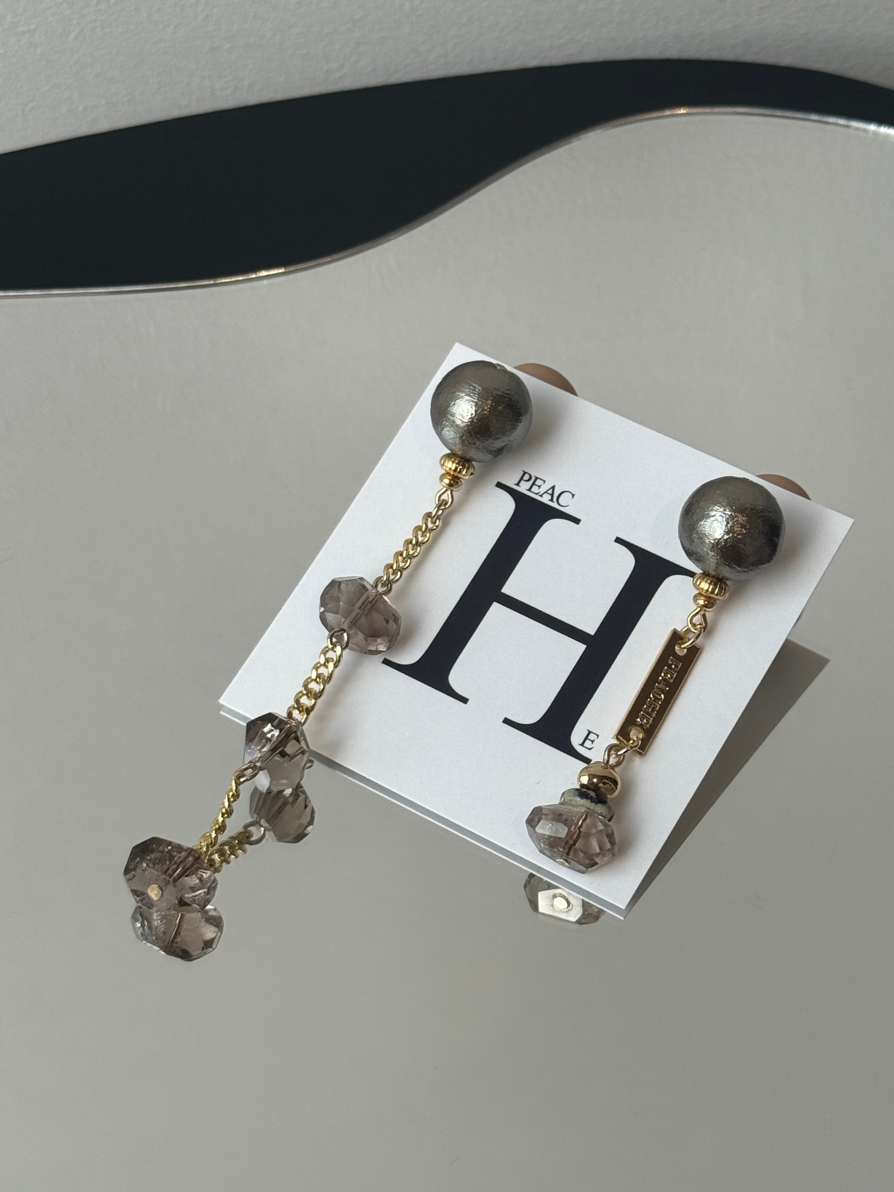 long chain grayish stone dot asymmetry