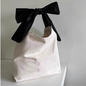 ribbon-shaped handle bag<b1886>