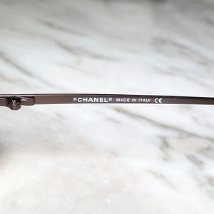 CHANEL rimless glasses with purple color lens